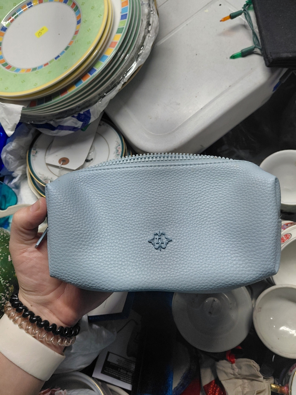 light blue Bash limited edition Mini Sac pouch with a textured leather